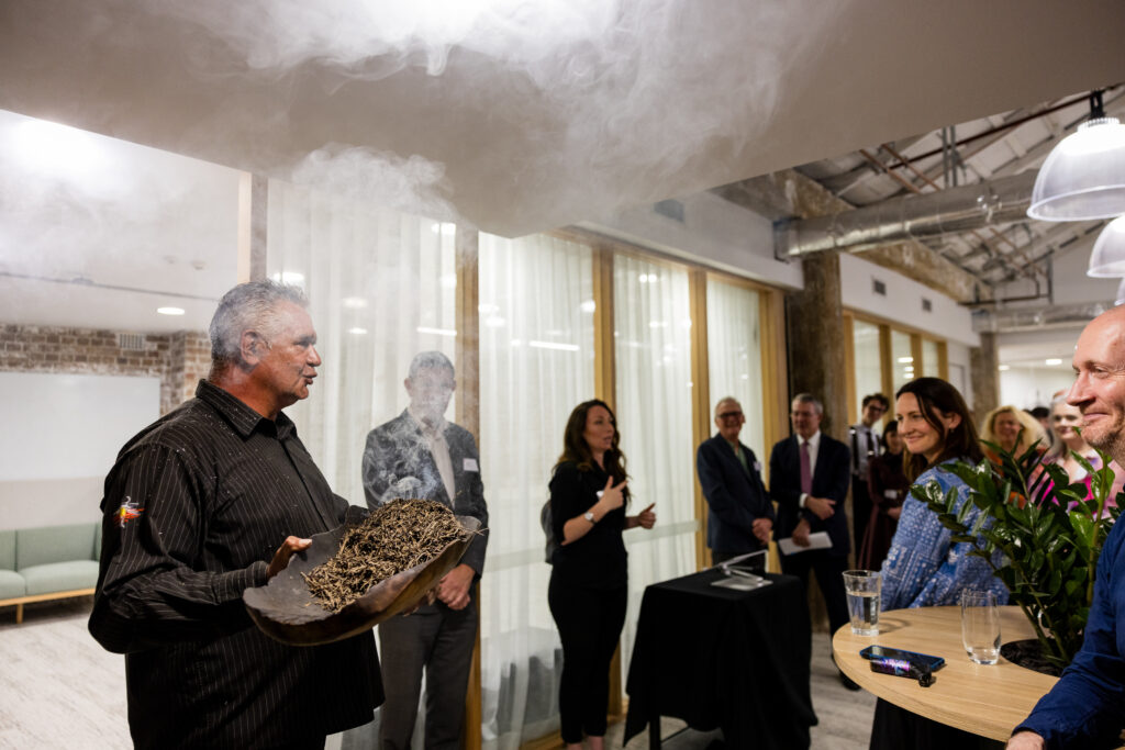 Raymond Weatherall conducts a Smoking Ceremony at Screenrights' office opening